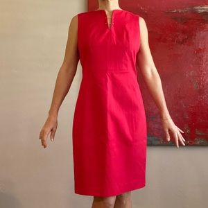 Ellie Tahari red dress with gold detail at chest. Size 10.
